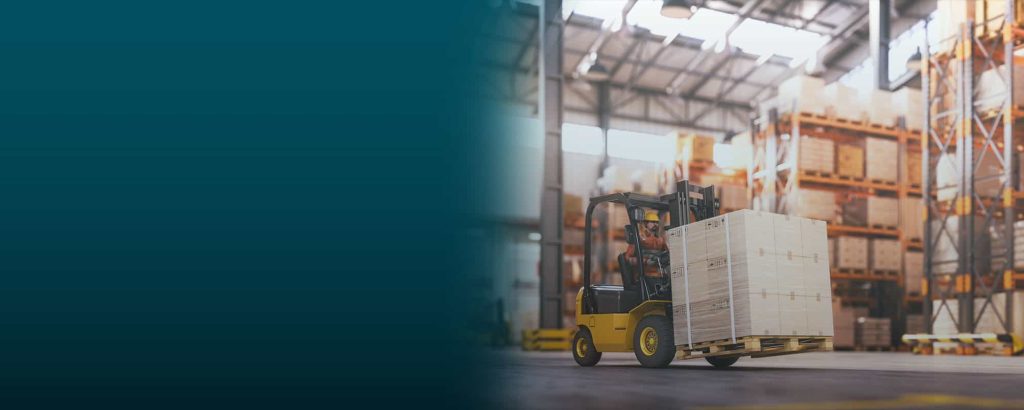 Forklift moving palletized goods in a warehouse